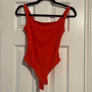 Skims red bodysuit
